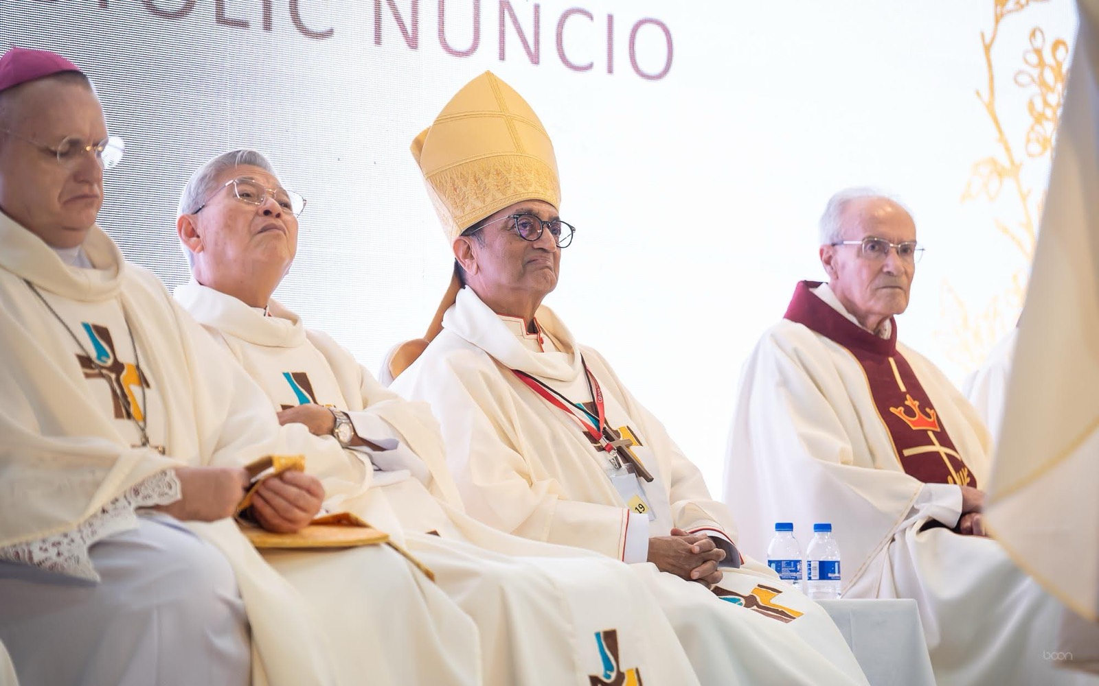 Bishops seated on stage during the anniversary celebrations