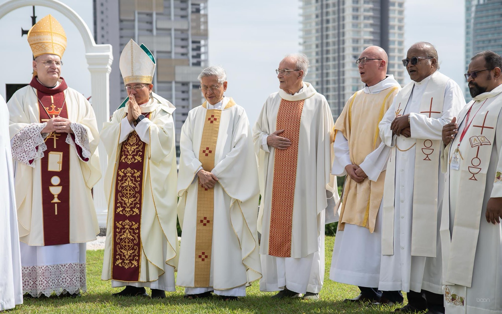 Bishops and priests at the memorial arches