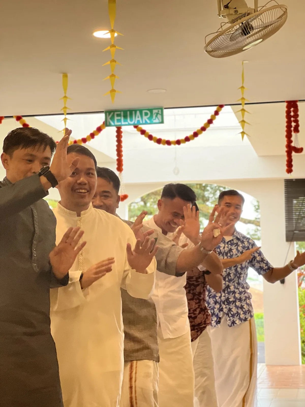 The community in traditional dress during a festive gathering