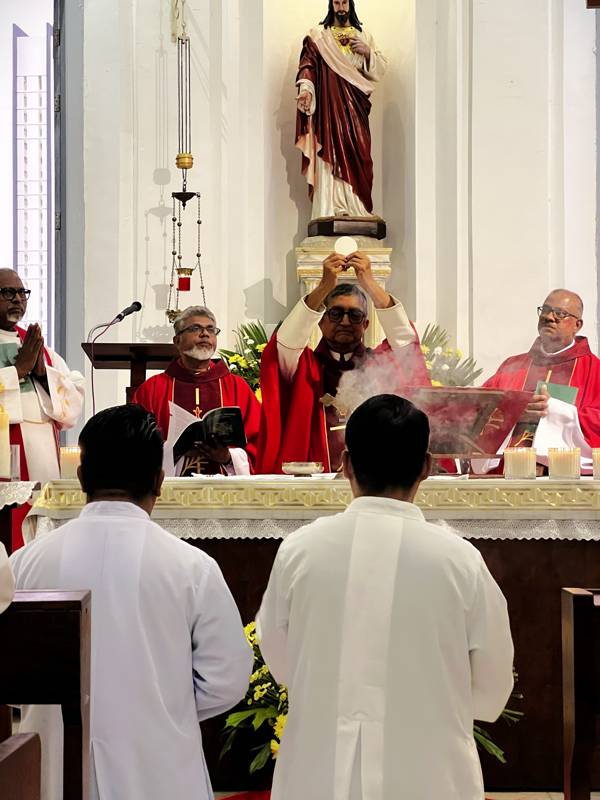The celebration of Mass before the altar and crucifix